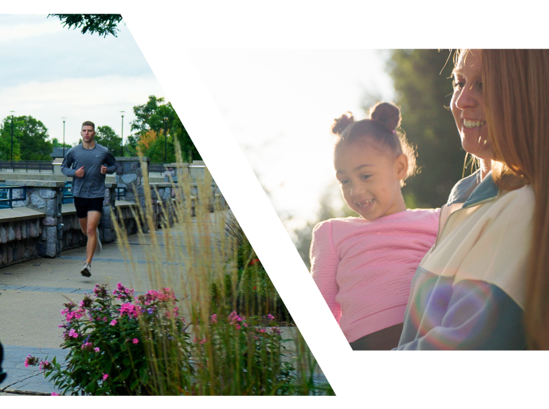 Mom and Daughter looking out in a sunset, a runner runs along the river in the Delta complex