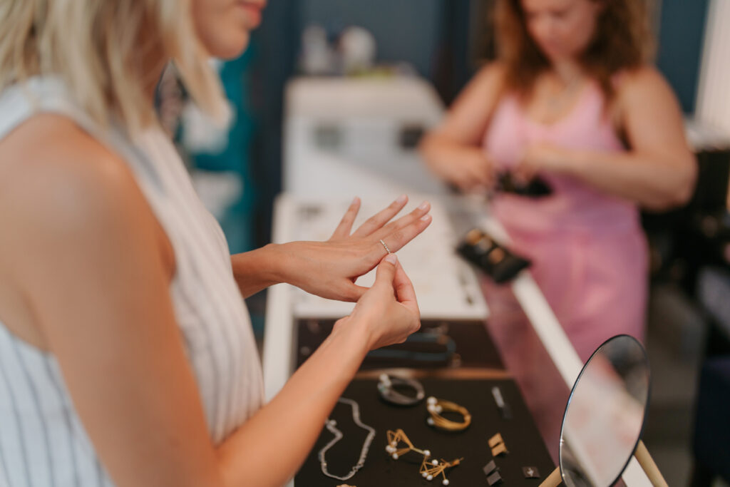  A woman trying on jewelry in a local jewelry store 